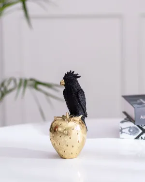 Black Cockatoo Parrot Figurine on a Gold Strawberry