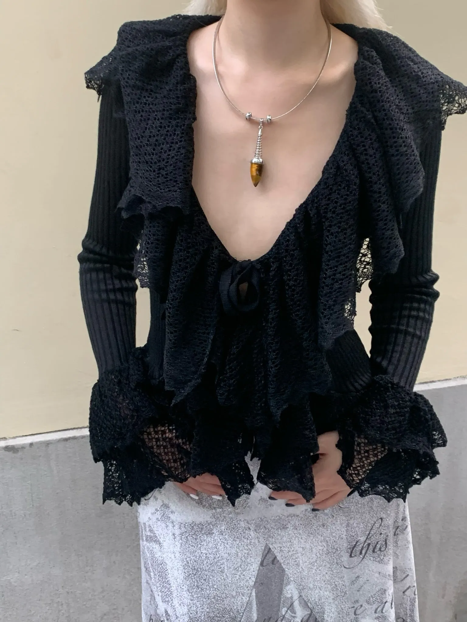 Black slim knit long sleeve top cardigan with ruffled edge