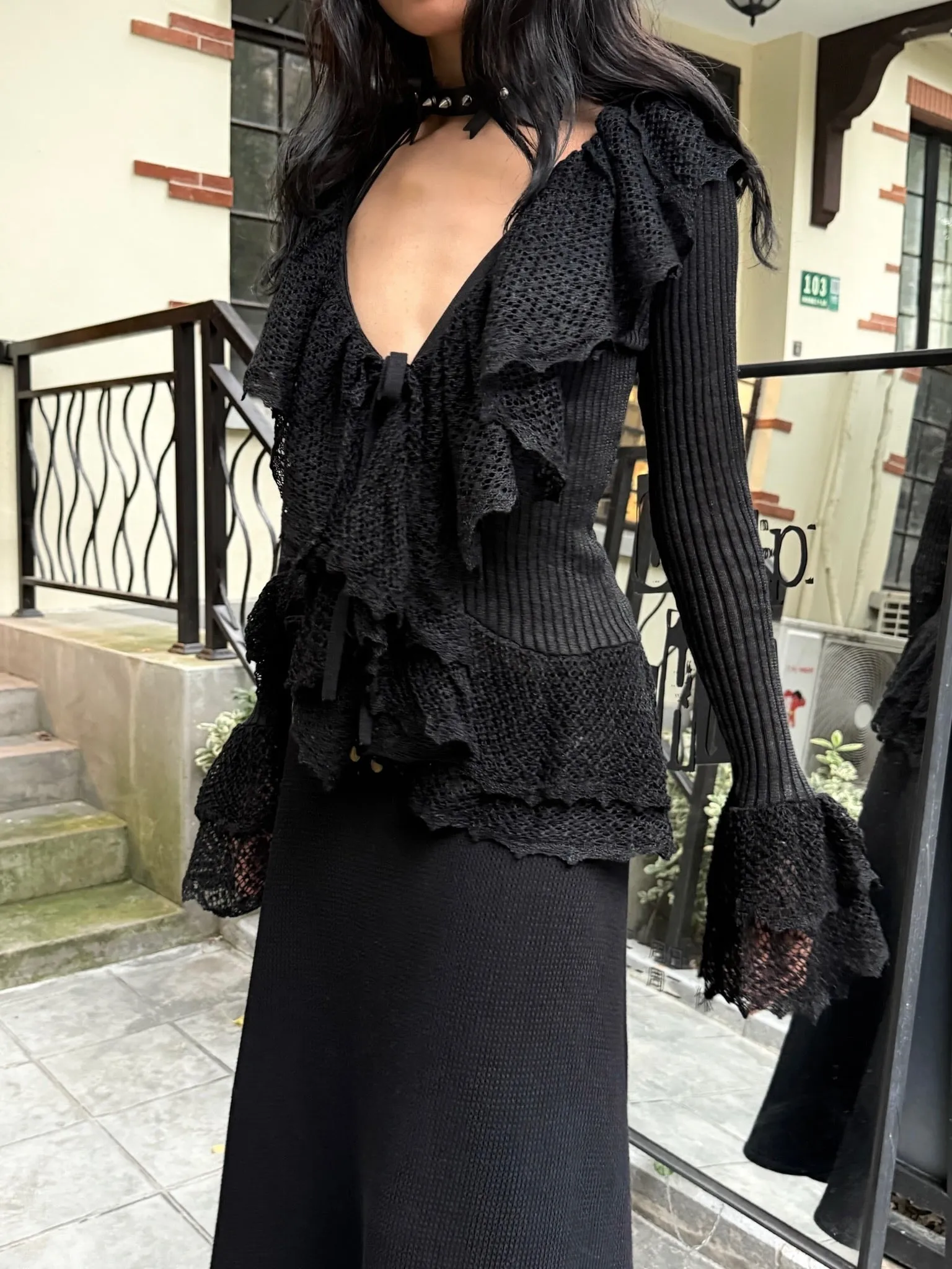 Black slim knit long sleeve top cardigan with ruffled edge